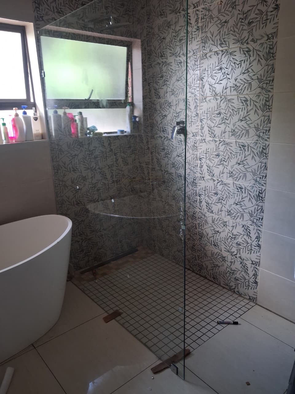 Newly renovated bathroom with a modern walk-in shower and freestanding bathtub